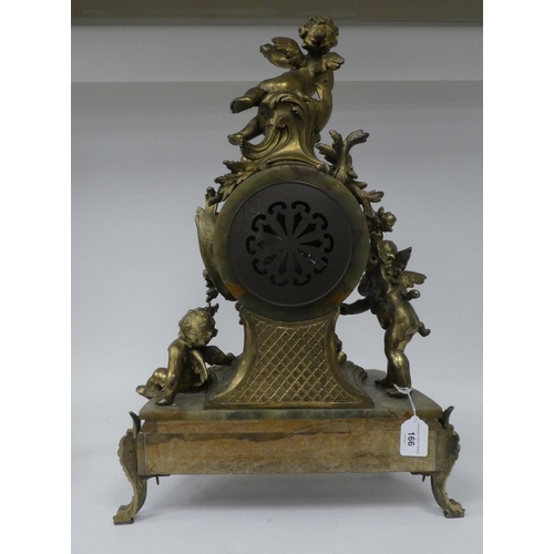 166 - A late 19thC Continental, gilded metal and green onyx cased mantel clock, featuring cavorting cherub... 