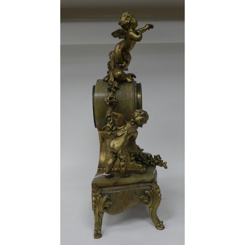 166 - A late 19thC Continental, gilded metal and green onyx cased mantel clock, featuring cavorting cherub... 