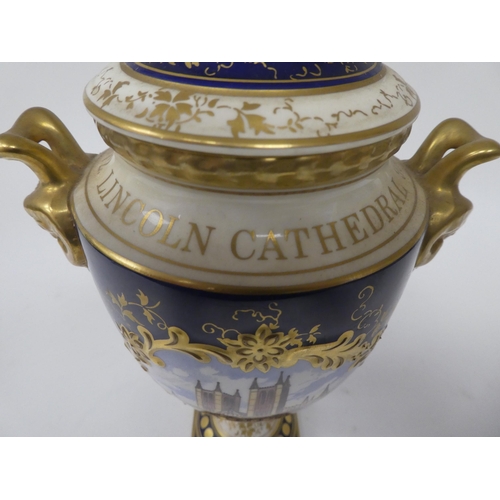 176 - A Coalport china twin handled pedestal vase and cover, promoting the 900th Anniversary of Lincoln Ca... 