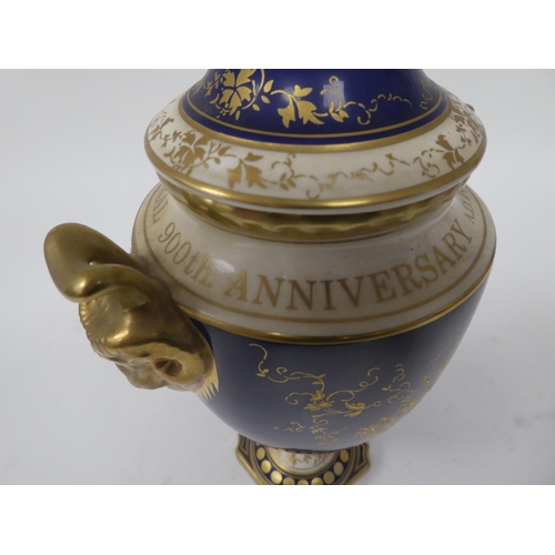 176 - A Coalport china twin handled pedestal vase and cover, promoting the 900th Anniversary of Lincoln Ca... 