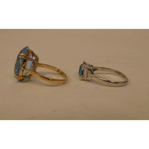 186 - Two dissimilar rings, set with aquamarine coloured stones