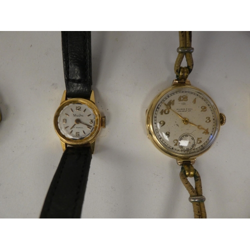 187 - Gold items of personal ornament, viz. three watches; and two dissimilar lockets  mixed carat ma... 