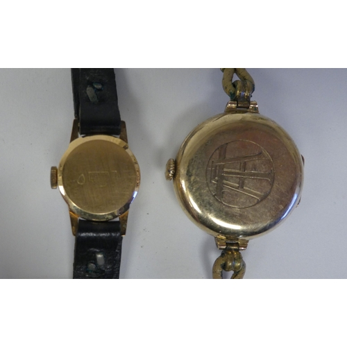 187 - Gold items of personal ornament, viz. three watches; and two dissimilar lockets  mixed carat ma... 