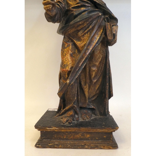 20 - An 18th/19thC carved wooden and polychrome standing biblical figure, on an integral plinth  23