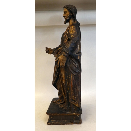 20 - An 18th/19thC carved wooden and polychrome standing biblical figure, on an integral plinth  23