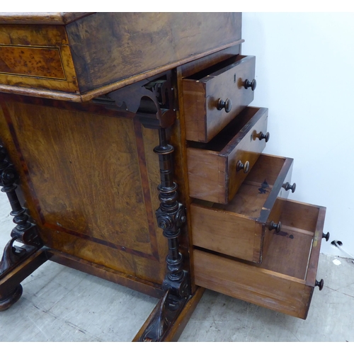 206 - A late Victorian crossbanded ebony and string inlaid, walnut finished Davenport with a hinged scribe... 