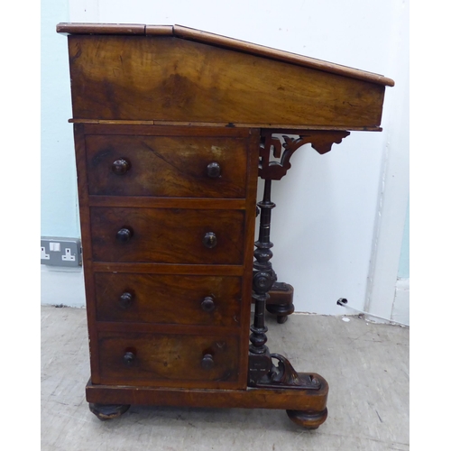 206 - A late Victorian crossbanded ebony and string inlaid, walnut finished Davenport with a hinged scribe... 