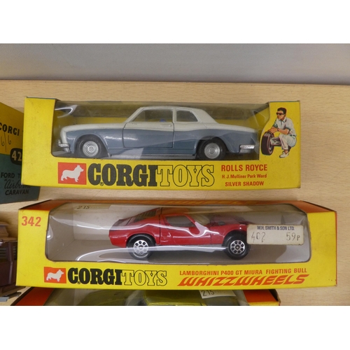 215 - Seven Corgi diecast model vehicles: to include a No.420 Ford Thames Caravan  boxed