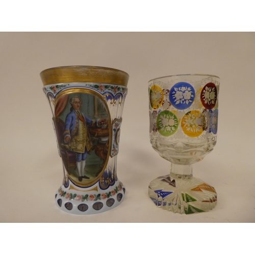 242 - Four late 19th/early 20thC items of decorative glassware: to include a pedestal wine, etched and eng... 