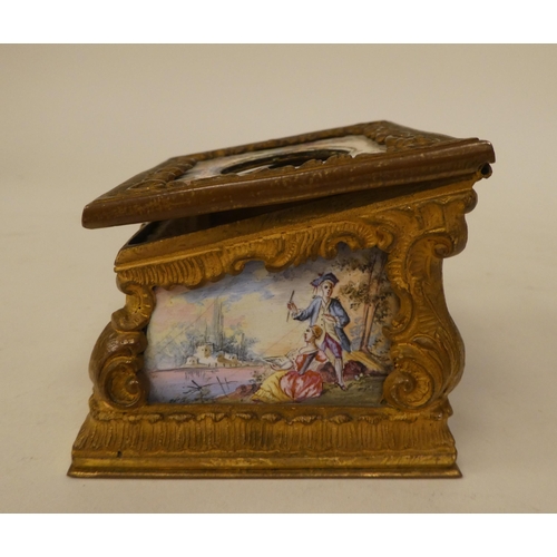 245 - A late 19thC Continental miniature timepiece (a/f), set in a rococo scrolled gilt metal and painted ... 