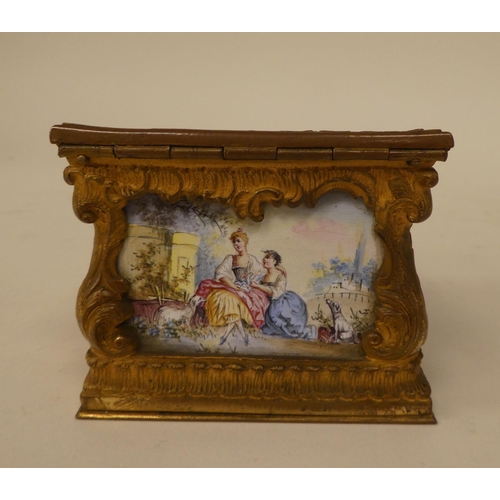 245 - A late 19thC Continental miniature timepiece (a/f), set in a rococo scrolled gilt metal and painted ... 