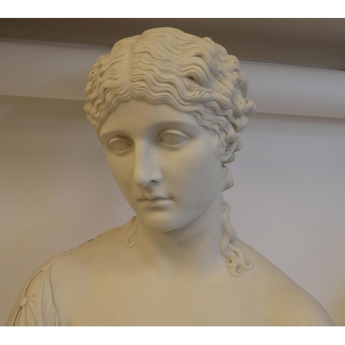 26 - A Victorian Copeland Parianware bust, a young woman, her hair in ringlets, on a two-part socle ... 