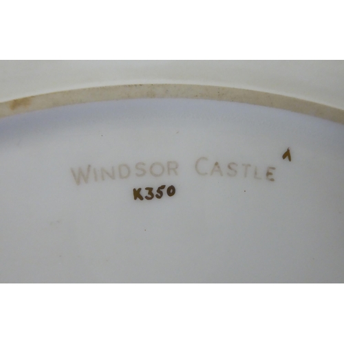 30 - A Minton china wall plate, decorated with a view from the river of Windsor Castle, within a wide, tu... 