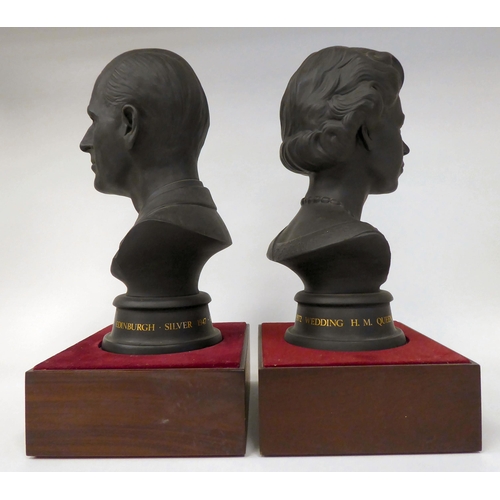 42 - A pair of Royal Doulton black basalt busts, respectively celebrating the wedding of HM The Queen Eli... 