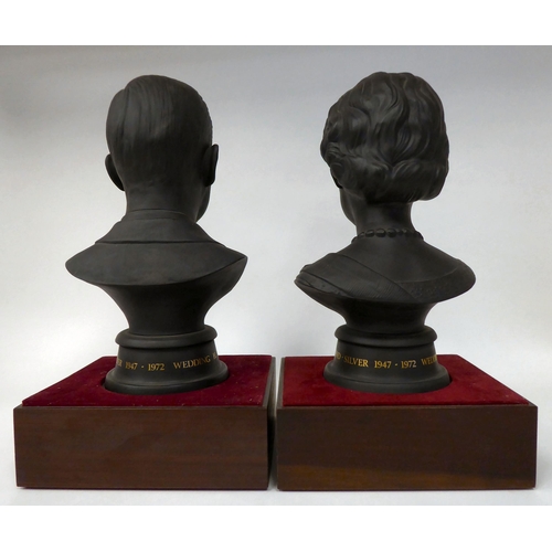 42 - A pair of Royal Doulton black basalt busts, respectively celebrating the wedding of HM The Queen Eli... 