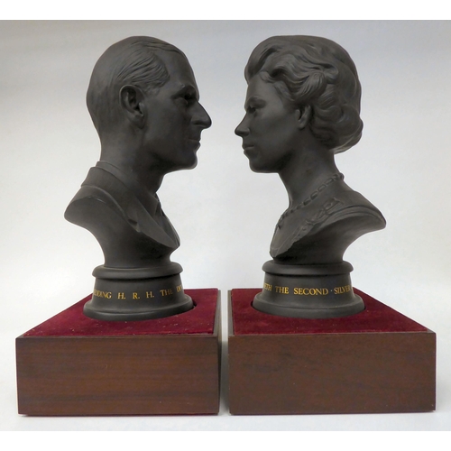 42 - A pair of Royal Doulton black basalt busts, respectively celebrating the wedding of HM The Queen Eli... 