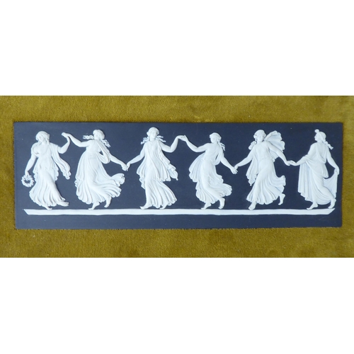 48 - A pair of Wedgwood black basalt and slip glazed plaques, featuring 'The Dancing Hours'  2.5