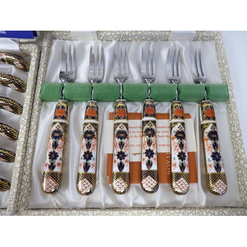 54 - A set of six (as new) Crown Derby porcelain and stainless steel knives and forks, decorated in the I... 