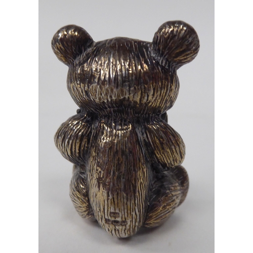 57 - A 20thC solid silver model, a Teddy bear wearing a bow tie  indistinct marks  2