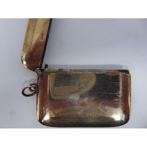 58 - A 9ct gold silver vesta case with a hinged cap and strike plate, on a pendant ring