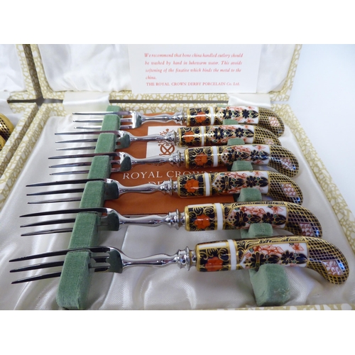 62 - A set of six (as new) Crown Derby porcelain and stainless steel knives, decorated in the Imari palet... 