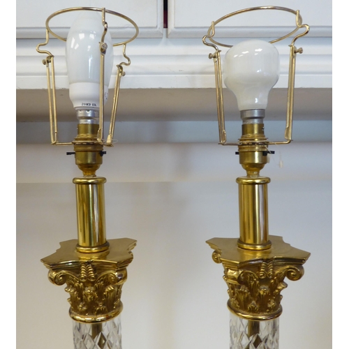 63 - A pair of modern moulded glass and lacquered brass column type table lamps with Corinthian capitals&... 