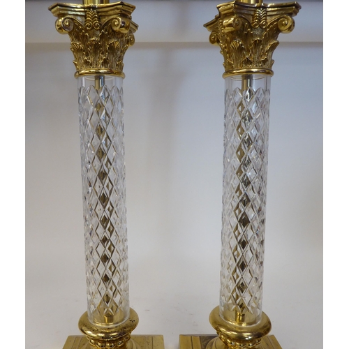 63 - A pair of modern moulded glass and lacquered brass column type table lamps with Corinthian capitals&... 