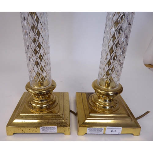 63 - A pair of modern moulded glass and lacquered brass column type table lamps with Corinthian capitals&... 