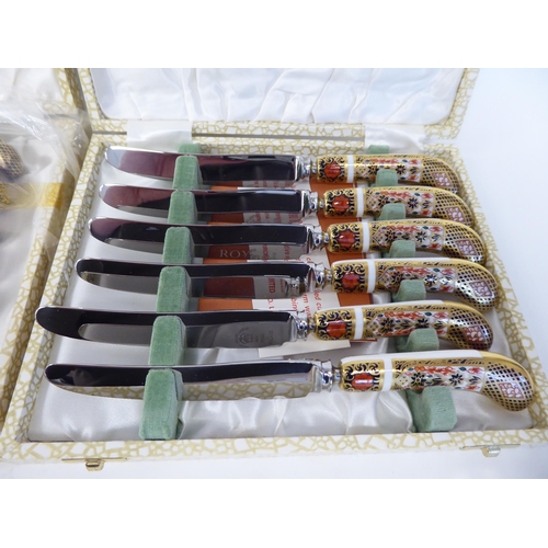 65 - A set of six (as new) Crown Derby porcelain and stainless steel knives, decorated in the Imari palet... 