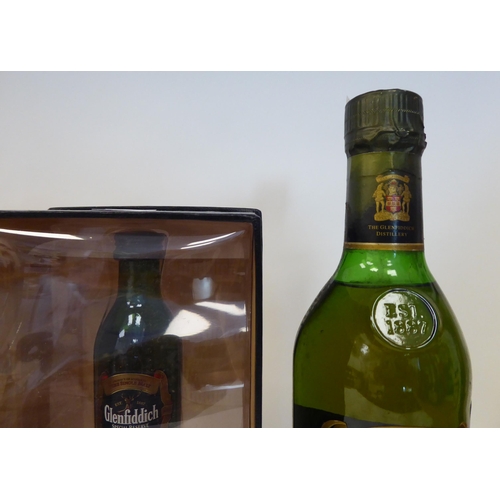 74 - Four bottles of whisky: to include one Glenfiddich 12 year old single malt miniature with a presenta... 