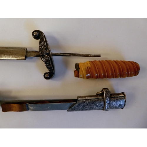 77 - Two World War II German daggers (incomplete)(Please Note: this lot is subject to the statement made ... 