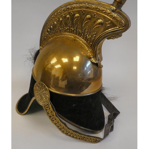 88 - A French Cuirassier brass officer's helmet with a red plume and hair tail(Please Note: this lot is s... 