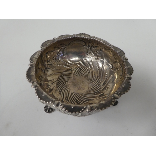 96 - A John Nicholson silver bowl, having a flared and lobed rim, embossed, chased and cast with birds, s... 