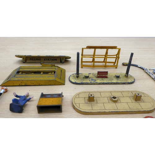 207 - Diecast model accessories, comprising road signs; petrol pumps; and figures