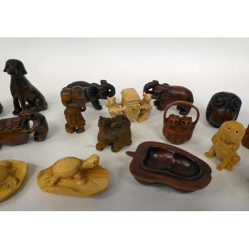 25 - Approx. twenty-five modern carved hardwood netsukes, in the form of various animals and figures