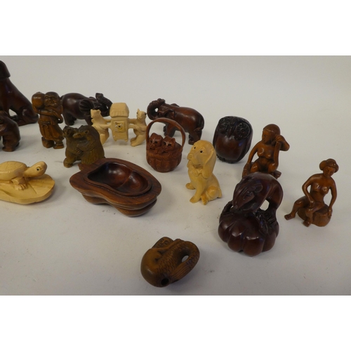 25 - Approx. twenty-five modern carved hardwood netsukes, in the form of various animals and figures