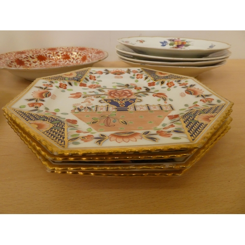 118 - Ceramics: to include four similar early 19thC Derby porcelain plates, each decorated with flora ... 