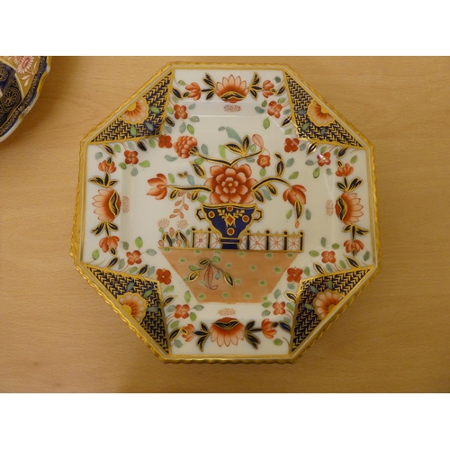 118 - Ceramics: to include four similar early 19thC Derby porcelain plates, each decorated with flora ... 