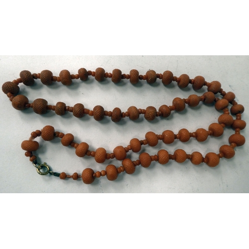 16 - Two carved coral bead necklaces