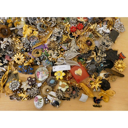 24 - Costume jewellery: to include brooches; and pin badges