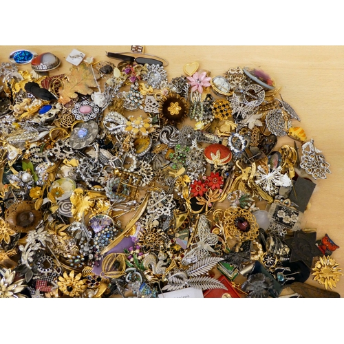 24 - Costume jewellery: to include brooches; and pin badges