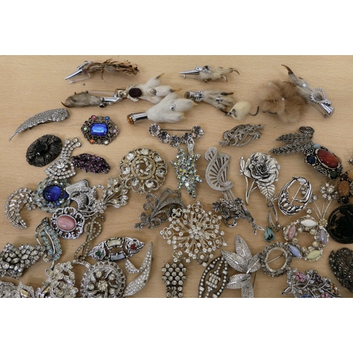 26 - Costume jewellery, mainly brooches: to include a rabbit foot example