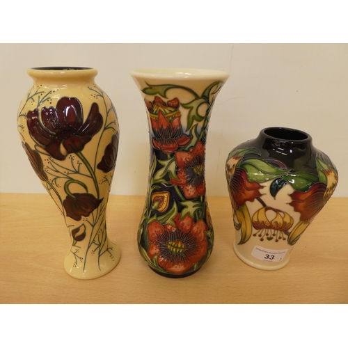 33 - Three items of modern Moorcroft pottery, decorated in tubeline and colours, variously marked, viz. a... 