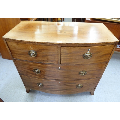 354 - An early 19thC mahogany bow front dressing chest with two short/two long drawers, raised on bracket ... 