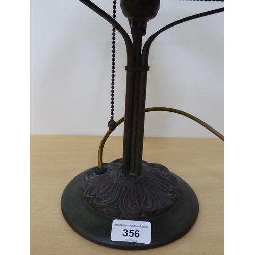 356 - An Art Nouveau design cast metal table lamp with a green glass shade  stamped Hubbell  14.5