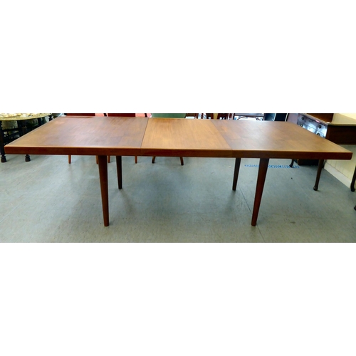 359 - A 1960/70s teak dining table, raised on turned, tapered legs  30