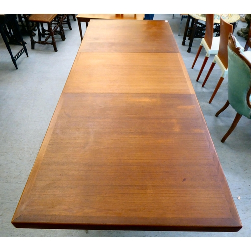 359 - A 1960/70s teak dining table, raised on turned, tapered legs  30