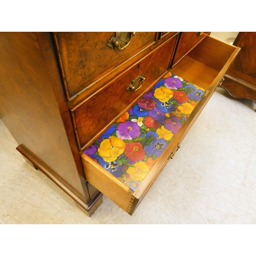 362 - A modern walnut dressing chest with five short/two long drawers, raised on bracket feet  35