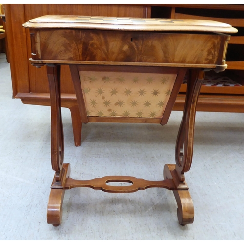 363 - A late Victorian mahogany work table with a hinged, chequerboard top, over a wool basket, raised on ... 