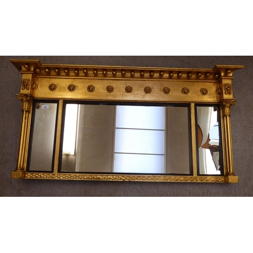 365 - A Regency design gilt framed overmantel mirror with ball ornament  24